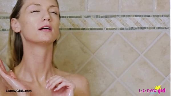 Captivating fair-haired model took a shower